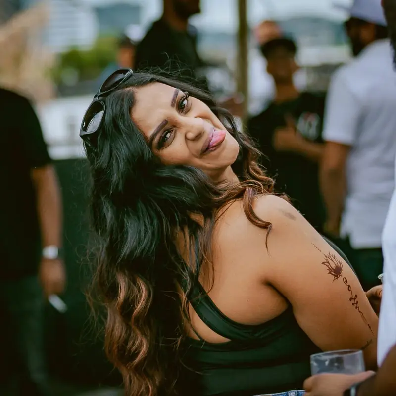 Guest smiling at the camera at HEY DESI